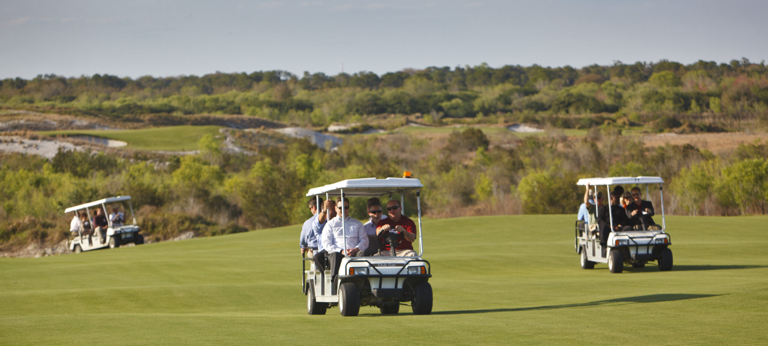 Golf carts riding around Streamsong Resort