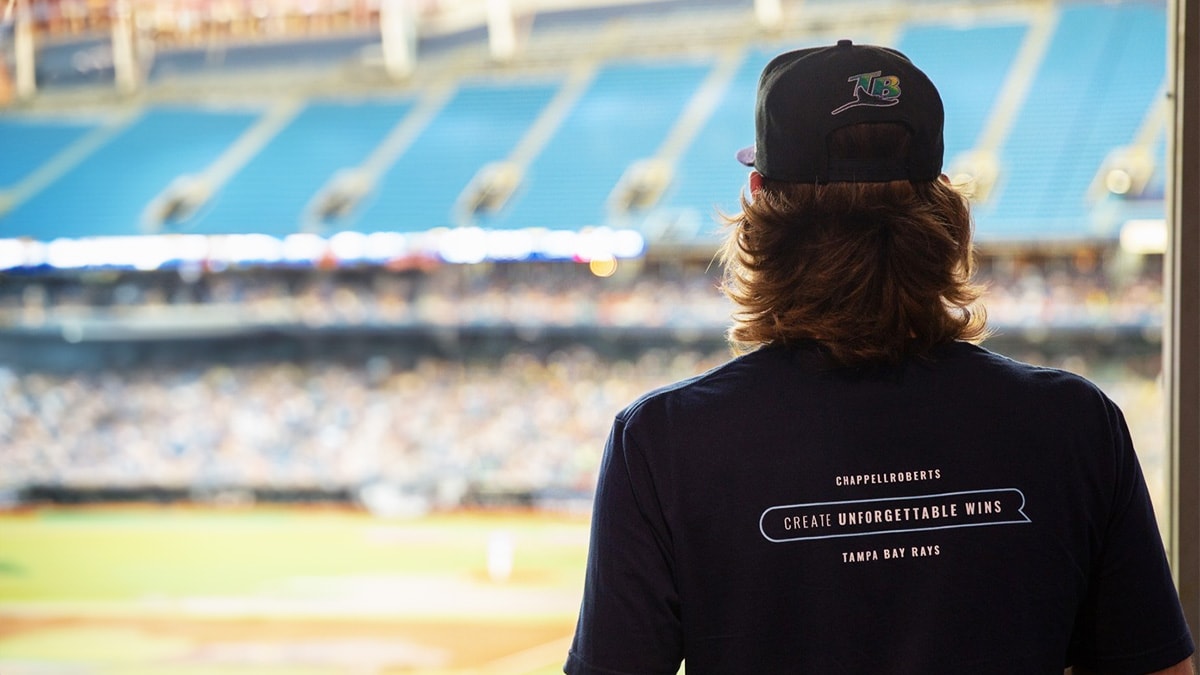 Brad watching a Rays game with a CR-branded t-shirt on