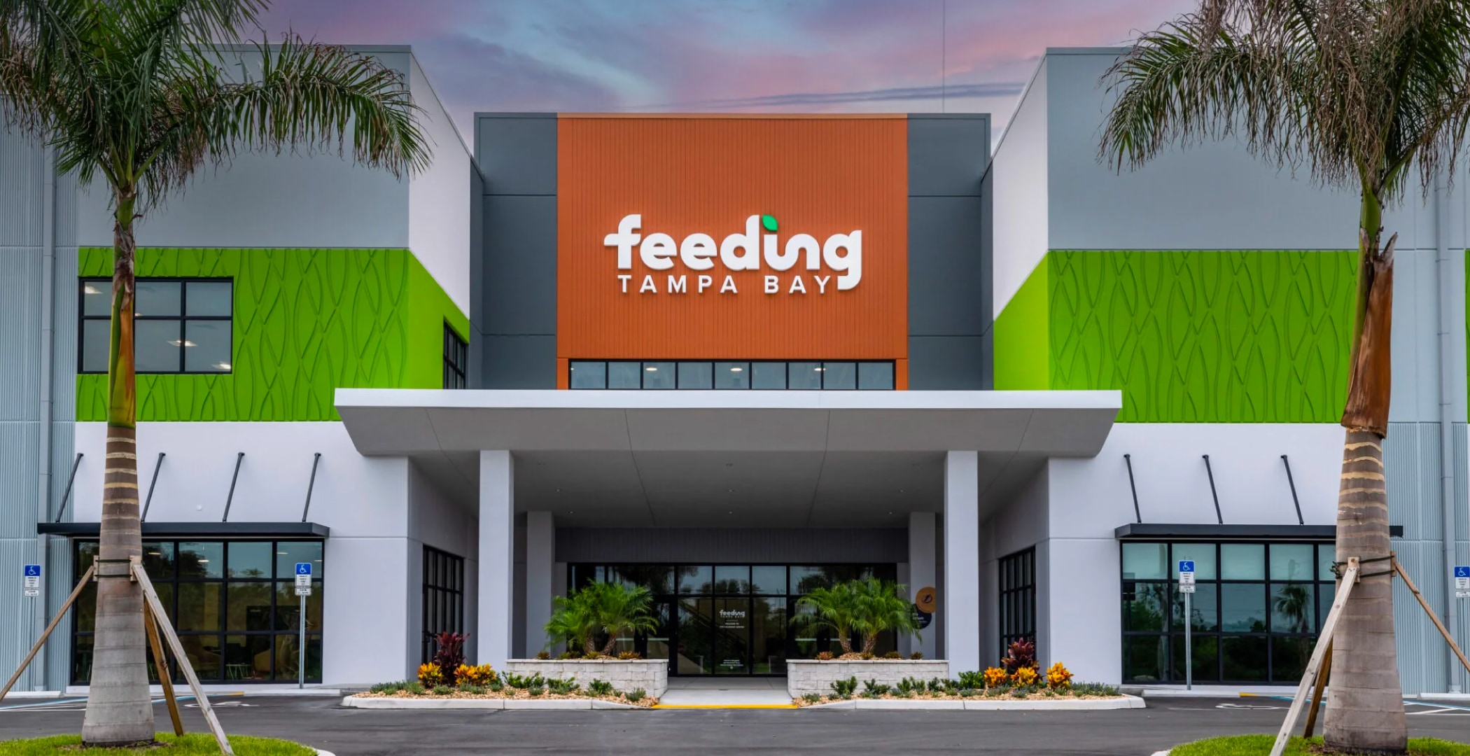 A photo showing the front of the Feeding Tampa Bay office building with the logo large on the front.