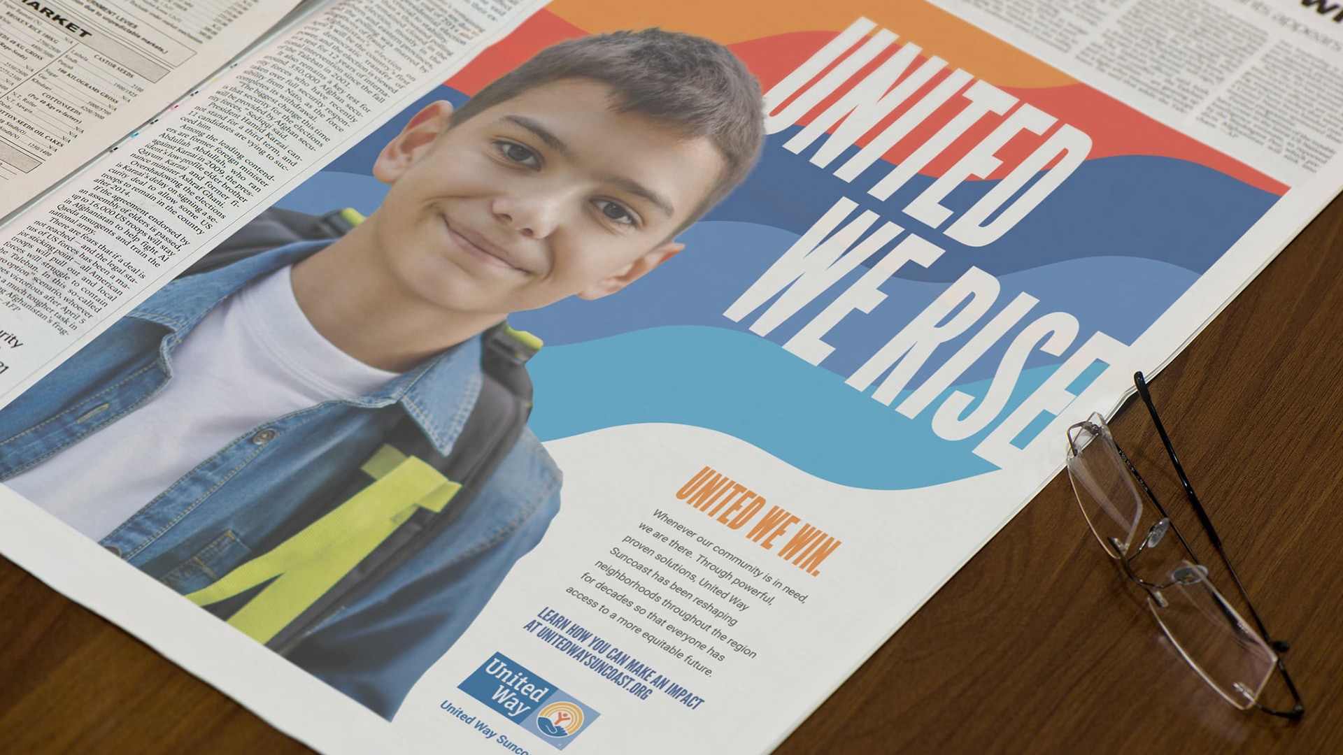 United Way Suncoast Newspaper Ad with a photo of a young boy with a backpack and the headline: United We Rise